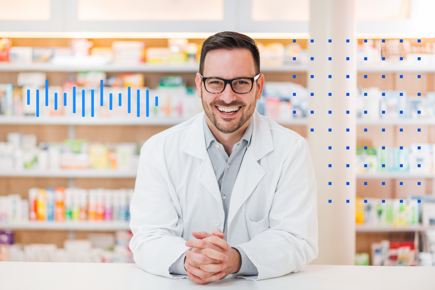 a pharmacist leans over pharmacy counter and smiles