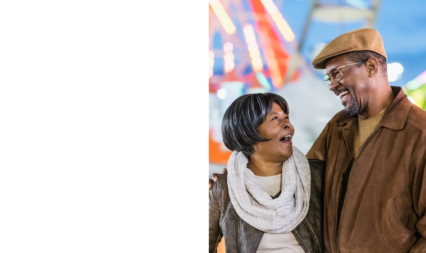 elderly couple visits a theme park and smiles